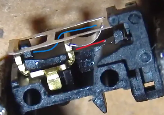 Inside of the Razer optical mouse switch v2 with foam areas in blue and red Inside of the Razer optical mouse switch v2 with foam areas in blue and red